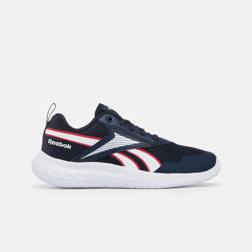 Sapatilhas Reebok Rush Runner 5 para criança em azul-marinho com detalhes em vermelho e branco sobre um fundo cinza claro