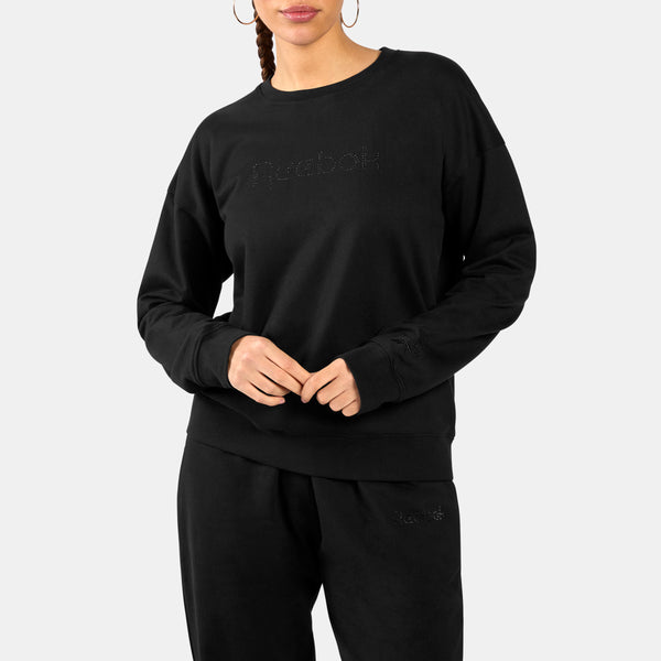 Person wearing a black Studded Logo Women's Crew Sweatshirt with a brand logo on a white background