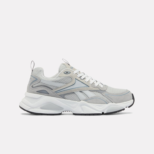 Gray and white Charge Run Men's Sneakers on a light gray background