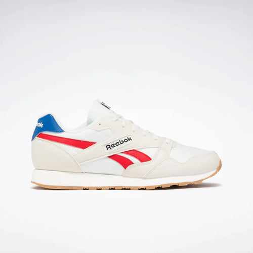 A pair of Reebok Ultra Flash Unisex Sneakers with a white mesh upper and red and blue accents.