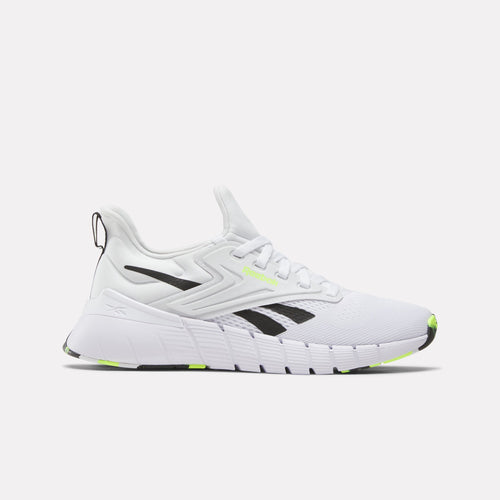 White Nano Gym Women's Shoe with black and green accents on a light gray background