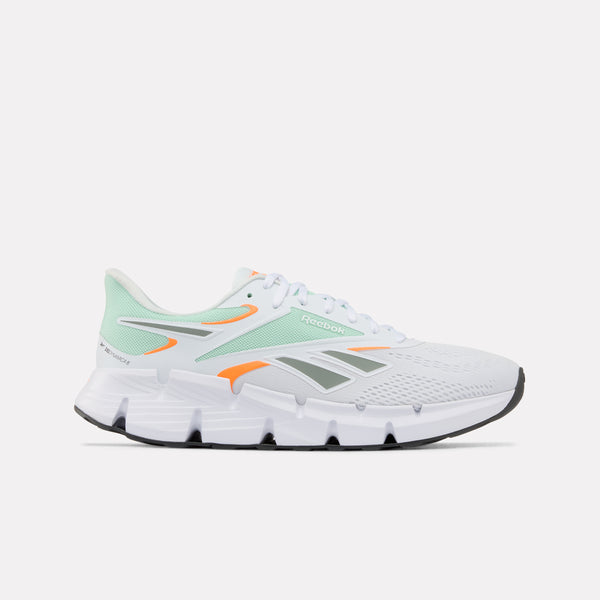 White Zig Dynamica 6 Men's running shoe with green and orange accents on a white background
