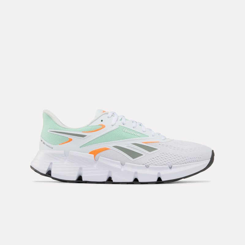 White Zig Dynamica 6 Men's running shoe with green and orange accents on a white background