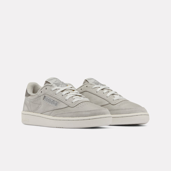 Pair of grey Reebok Club C 85 Vintage Women's Sneakers on a white background