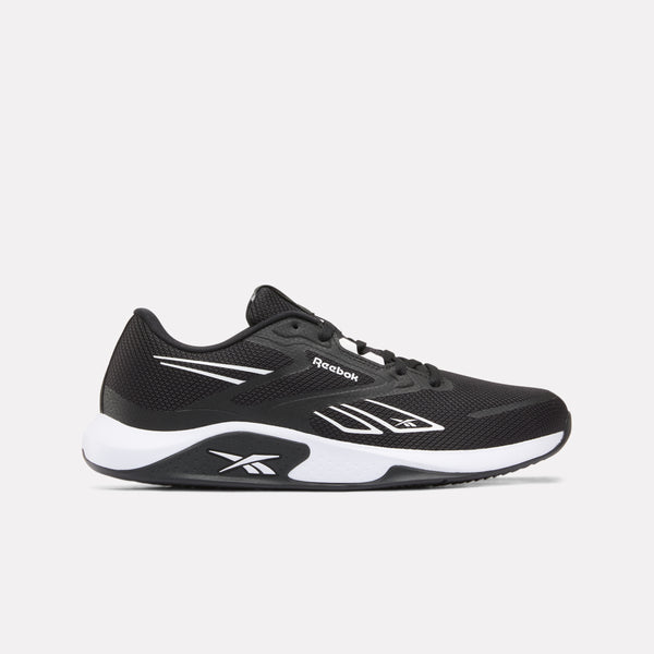 A Reebok athletic sneaker in black and white, shown from a side profile view against a light gray background.