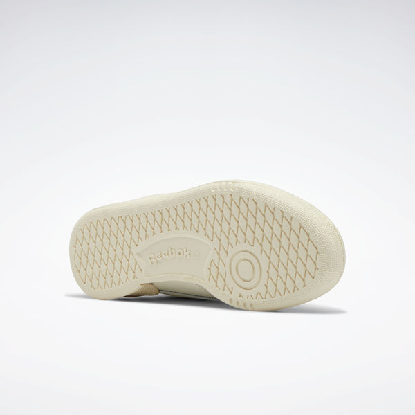 White sneaker sole with Reebok logo on a light gray background