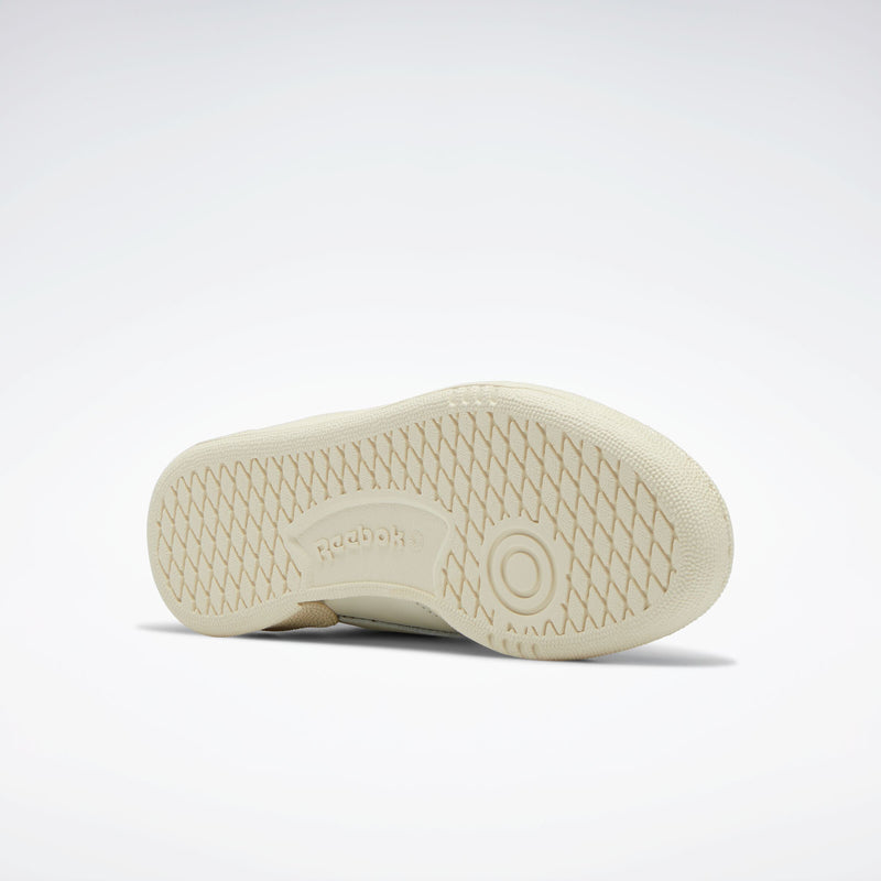 White sneaker sole with Reebok logo on a light gray background