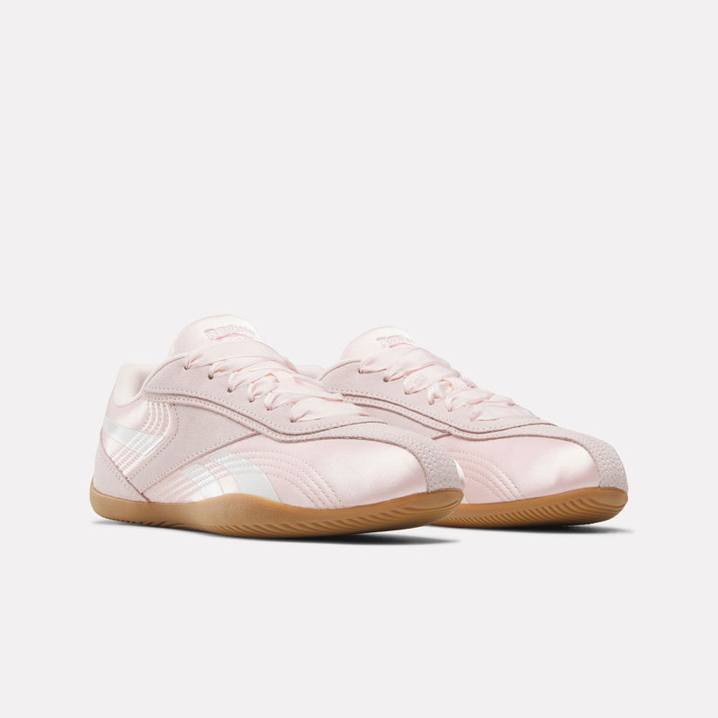 Pair of light pink Reebok Ultra Lo Women's Sneakers with brown soles on a white background